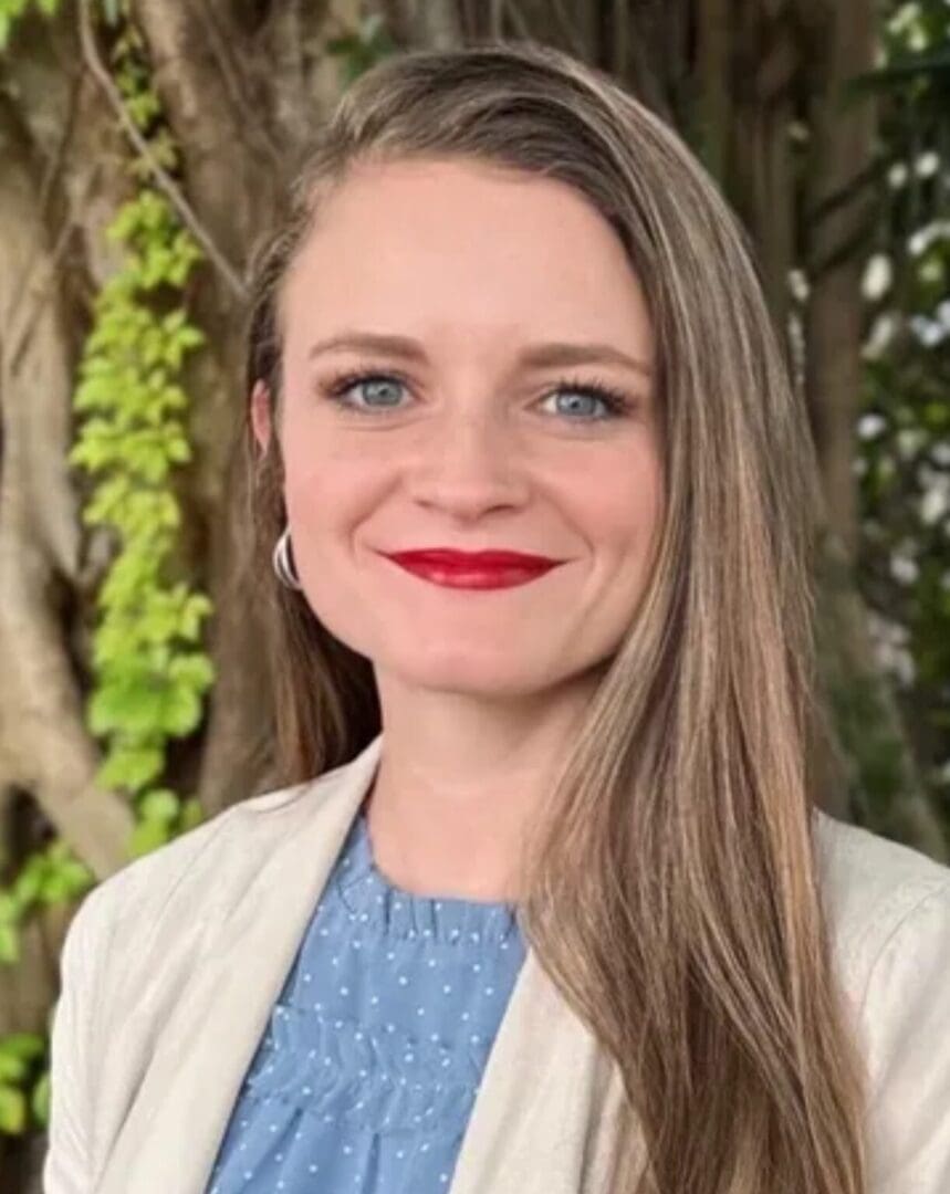 Smiling woman portrait with tree background